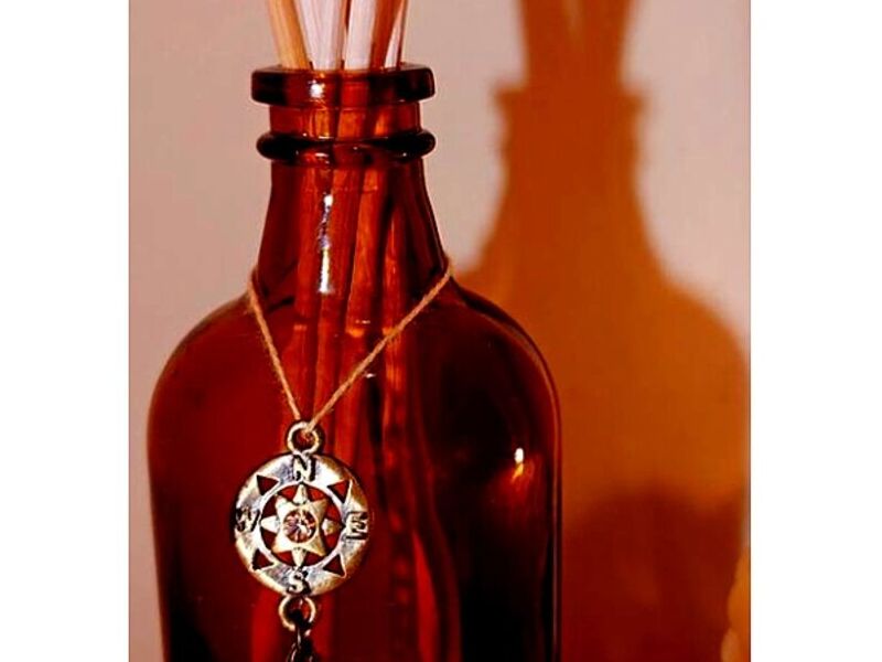 Botellita en vidrio ámbar coronada  Bolivia